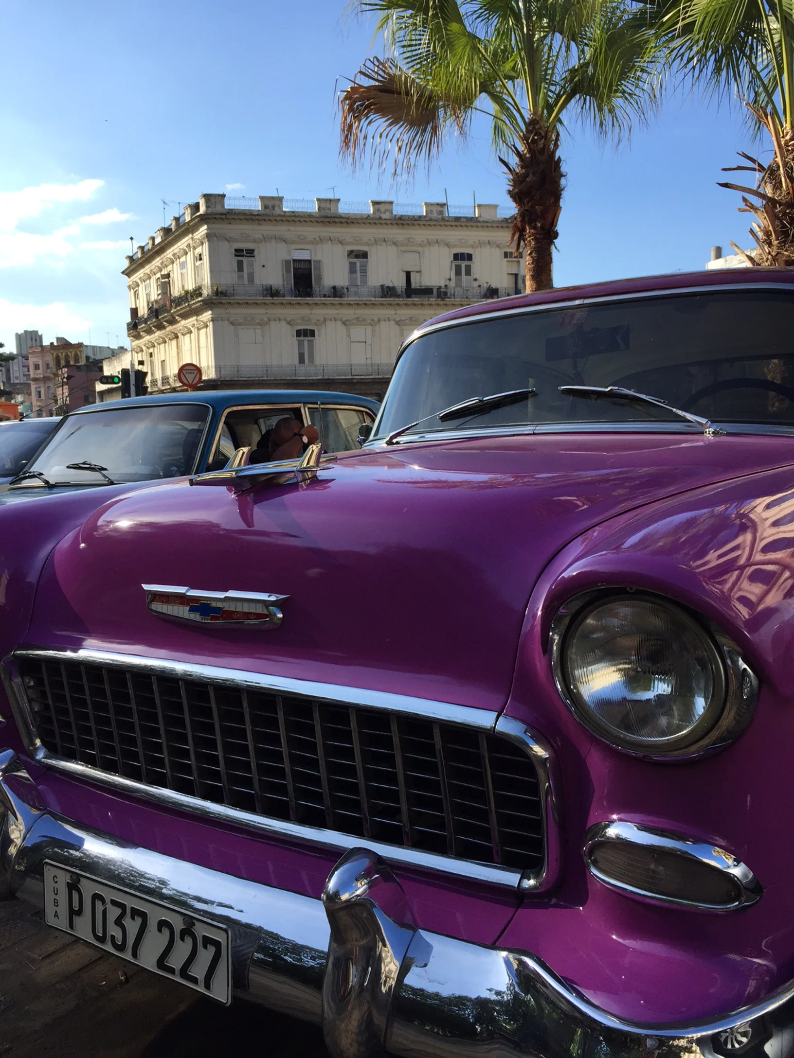 Classic cars parked by La Floridita hotel