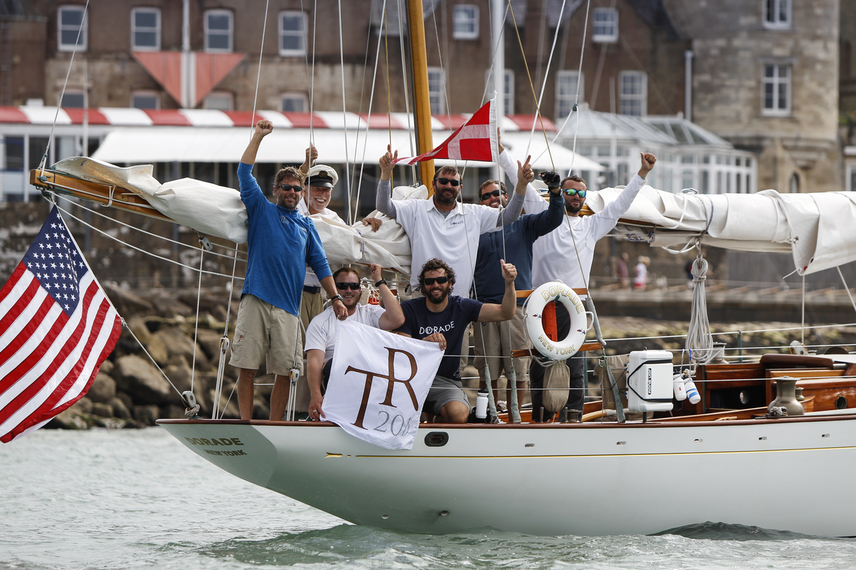 The crew on Dorade celebrate reaching the Royal Yacht Squadron to conclude their Transatlantic Race 2015.