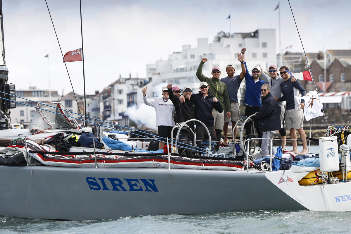 The crew of S iren are all smiles at the Transatlantic Race 2015 finish line. (photo credit ELWJ Photography) 