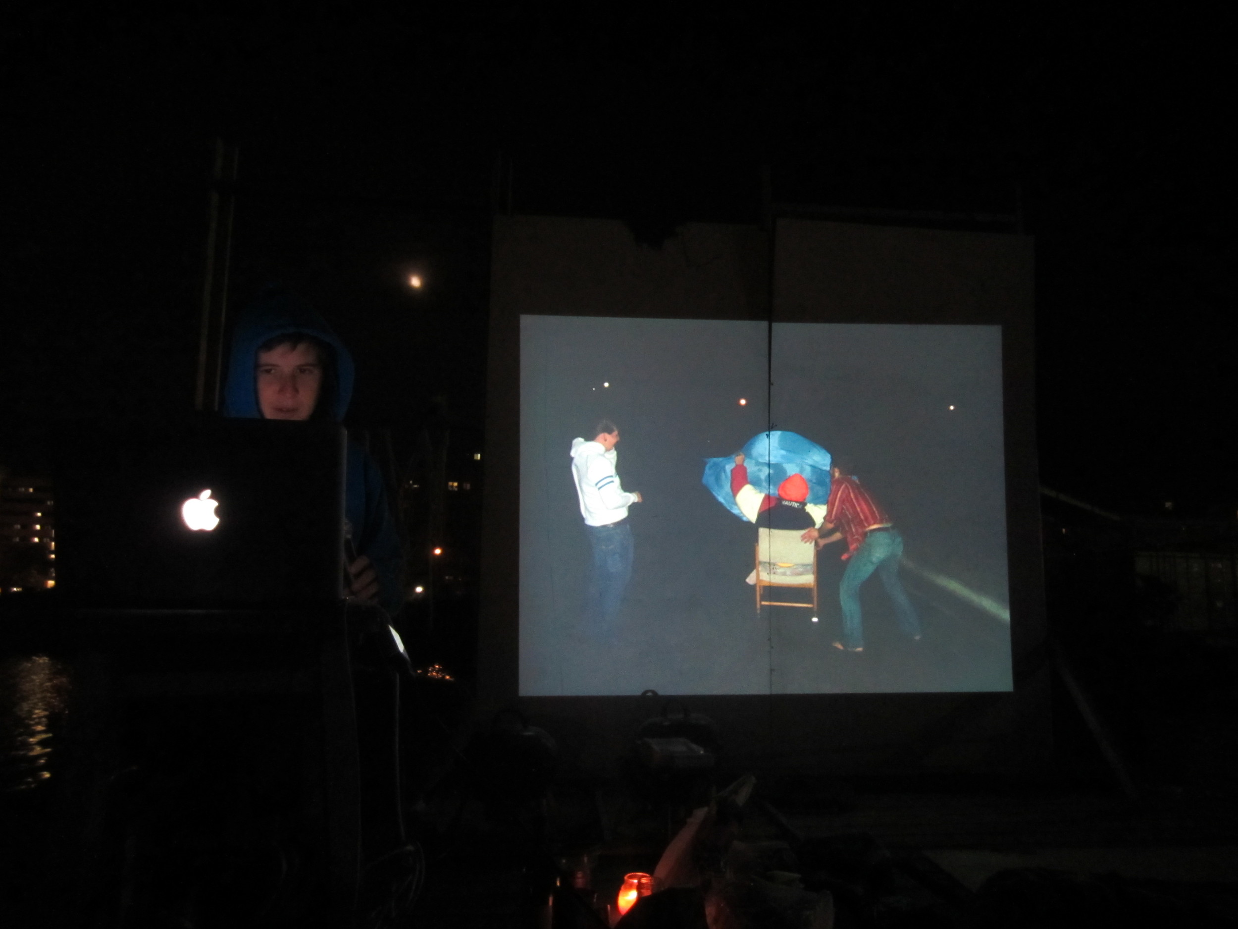 MORE LECTURE IMAGES AND VIDEOS TO COME......... This is a lecture I gave titled Absolute Absolution, 2011 on the Boatel's floating stage. This particular image is of my me and my brother trying to sail our dad down a windy street in an offi