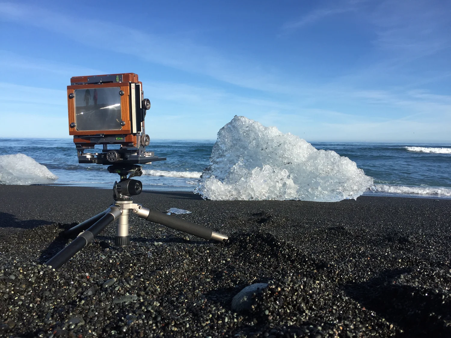 BTS of JÖKULSÁRLÓN SHORE STUDY I. My tripods go through Hell. They spend a good deal of their lives in salt water, and for this one, I dug pits for each leg to sit in, so I could get the camera as low as possible.