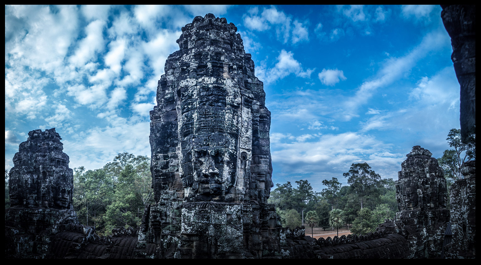 The beautiful faces surrounding the entire temple!