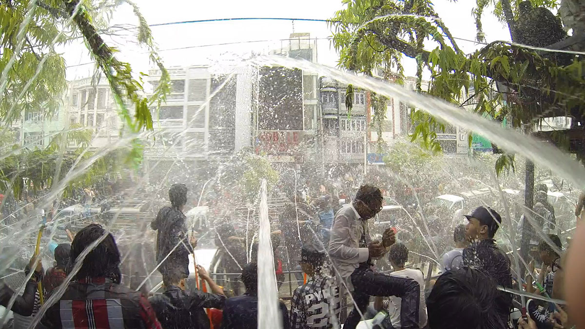 We got up on one of the stages and were spraying people with water! The streets were deadlocked with people and pick-up trucks carrying loads of people to the festival. 