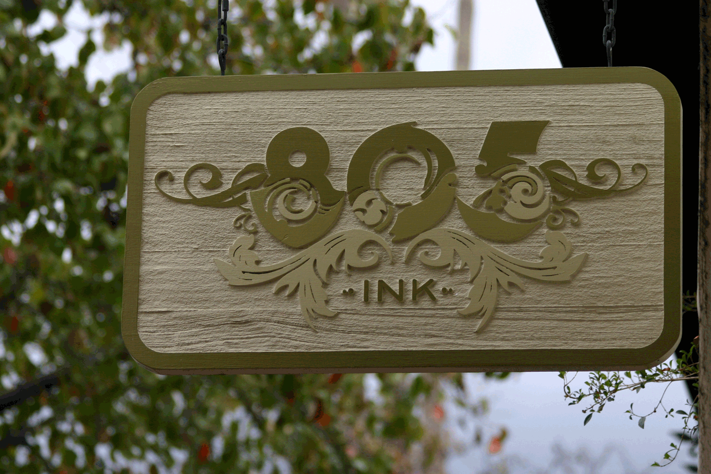 hanging-sign-etched-hand-painted-wood.png