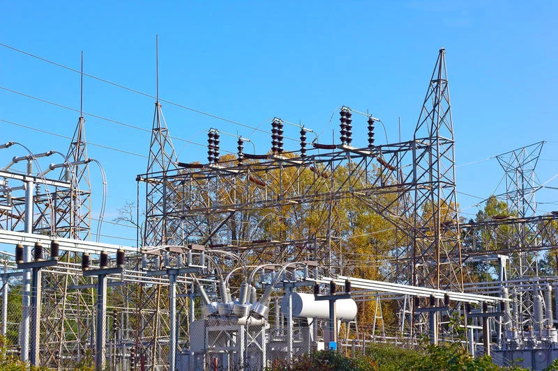 electrical-power-equipment-high-voltage-substation-industrial-landscape-fall-foliage-under-clear-blue-sky-46449958.jpg