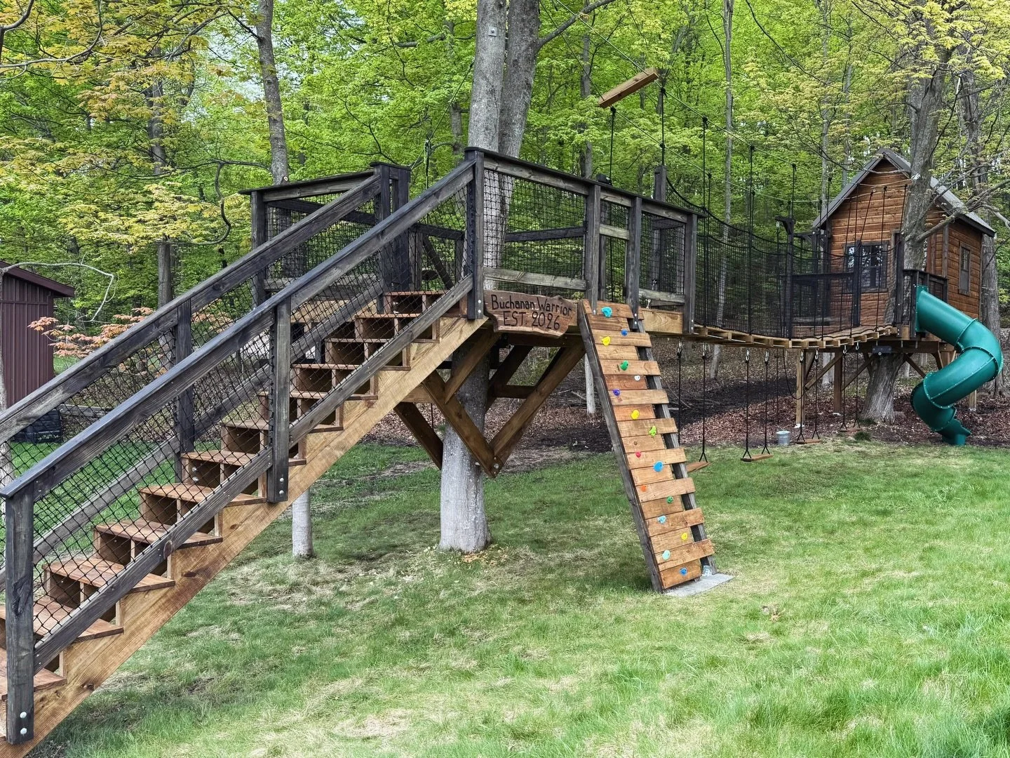 That&rsquo;s a wrap on our Michigan build! Designed with 10 grandkids in mind, this treehouse has it all &ndash; a suspended bridge, zipline, net loft, climbing wall and more. Swipe through to see all the fun-add ons! 

#kidstreehouse #treehouseexper