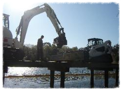 The stringers are hooked up to the tractor and swung into place.