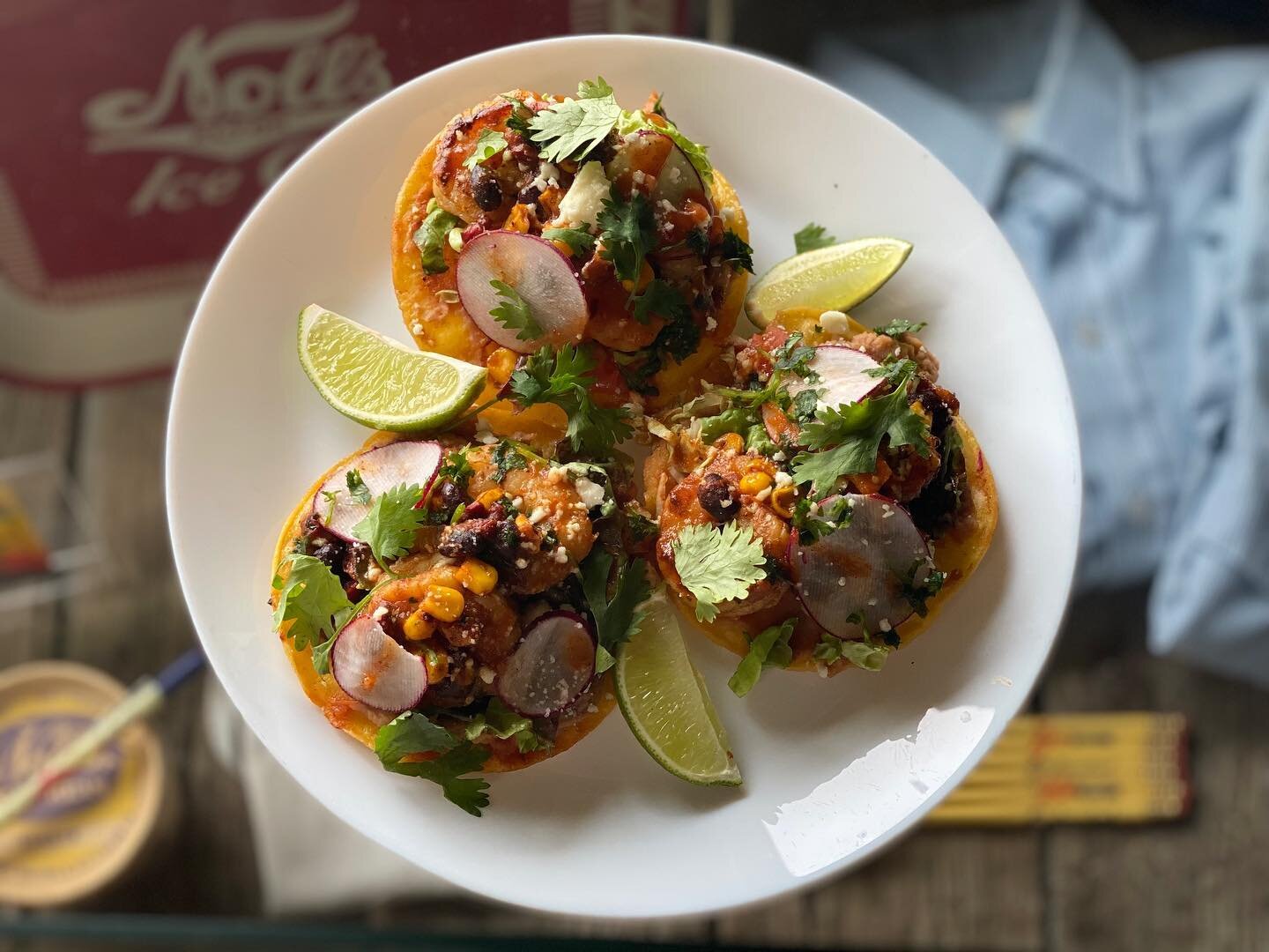 Grilled Shrimp Tostada on special today!  3 crispy tortillas topped with  refried beans, lettuce, corn, black beans, queso fresco, radish, cilantro, grilled shrimp, and a tomatillo chili sauce!