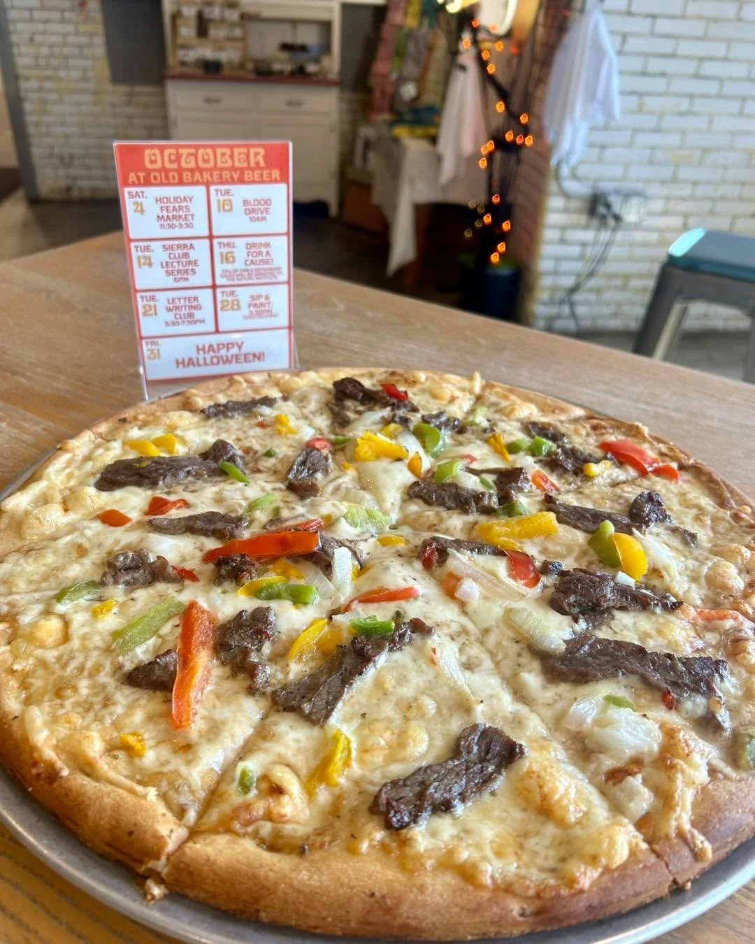 Today’s specialty pizza is inspired by the classic Cheesesteak and is topped with Beef Jus, 3 Cheese Blend, Skirt Steak, Peppers, and Onions.
Today is also Drink for a Cause for The Nature Institute!  25% of all beer and herbarium sales today