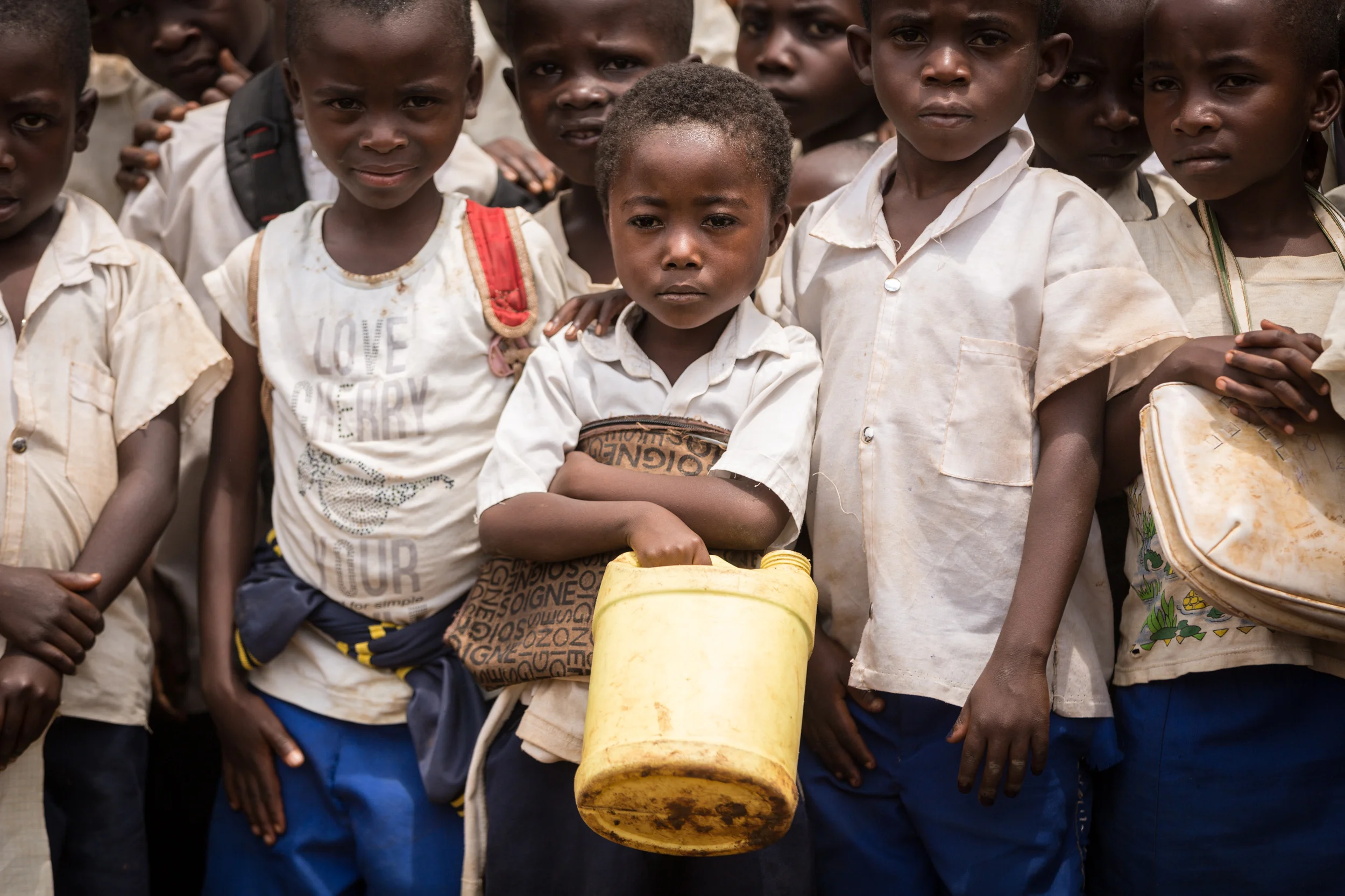 Young students wait for a hand-washing lesson to begin in Karambi, Eastern Democratic Republic of Congo. 10.21.2017