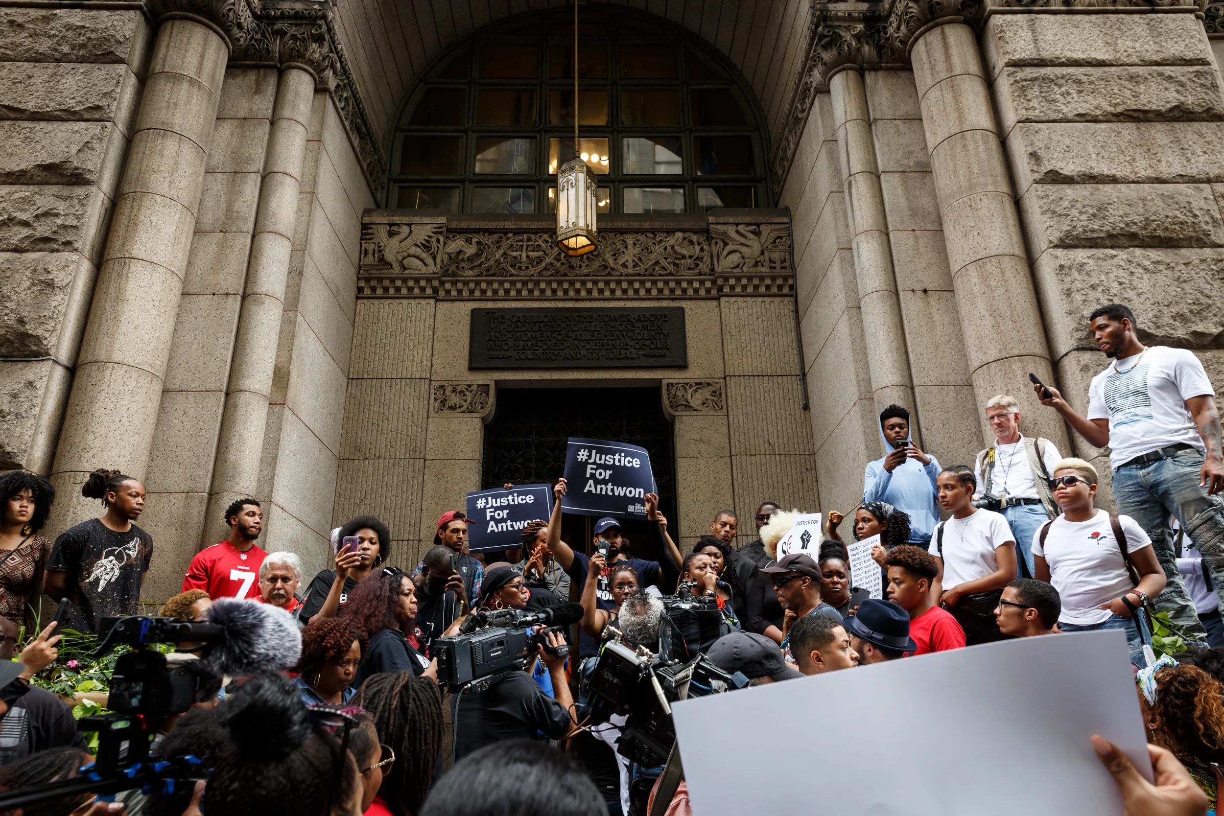 Several hundred people gathered on Grant Street in front of the Allegheny County Courthouse on Thursday to protest the death of Antwon Rose Jr. The Allegheny County police are investigating the teenager’s death and named the police officer who killed him as Michael Rosfeld of the East Pittsburgh police.