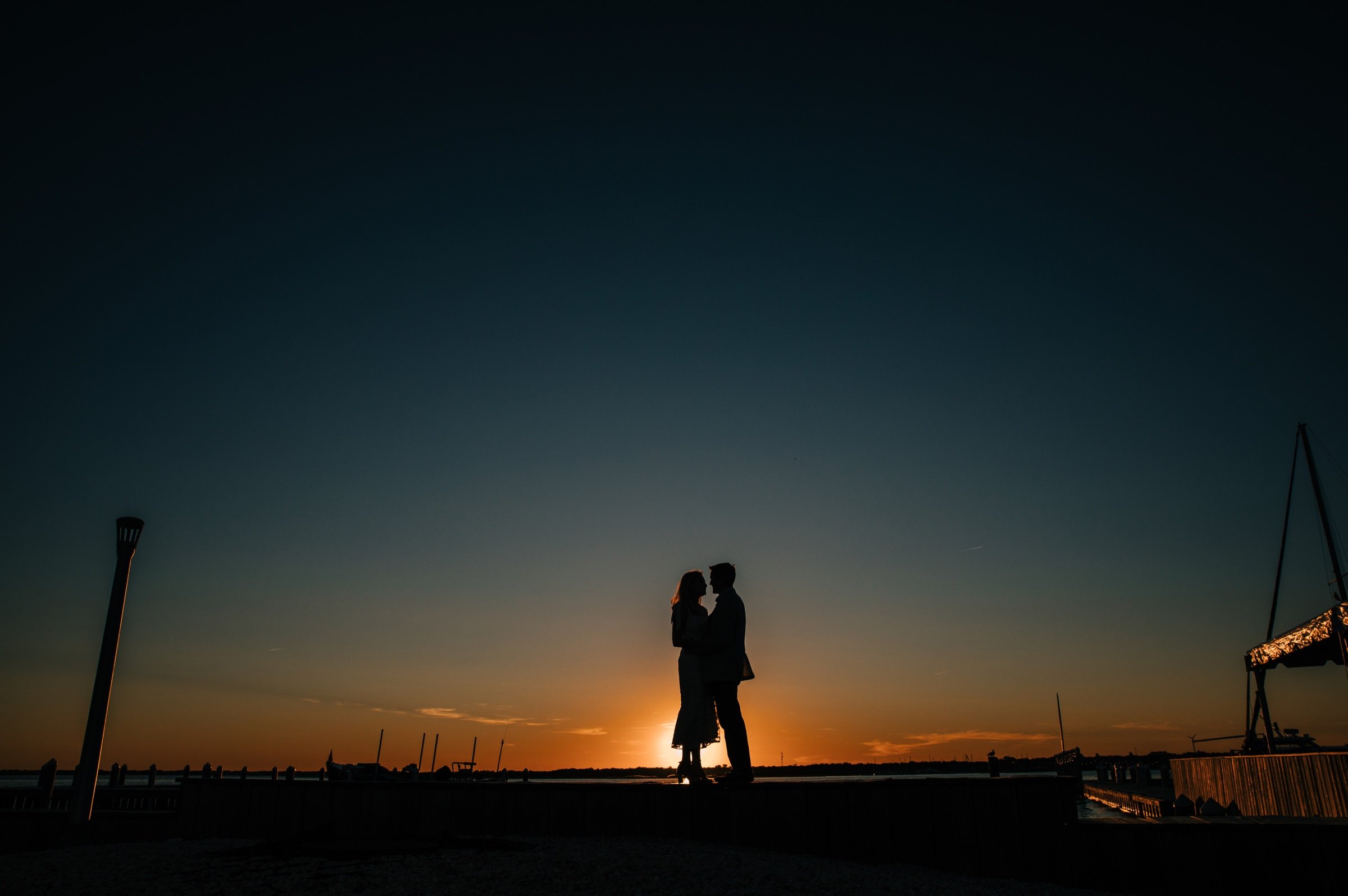 17_Sunset couples portrait at mantoloking yacht club new jersey rehearsal dinner.jpg