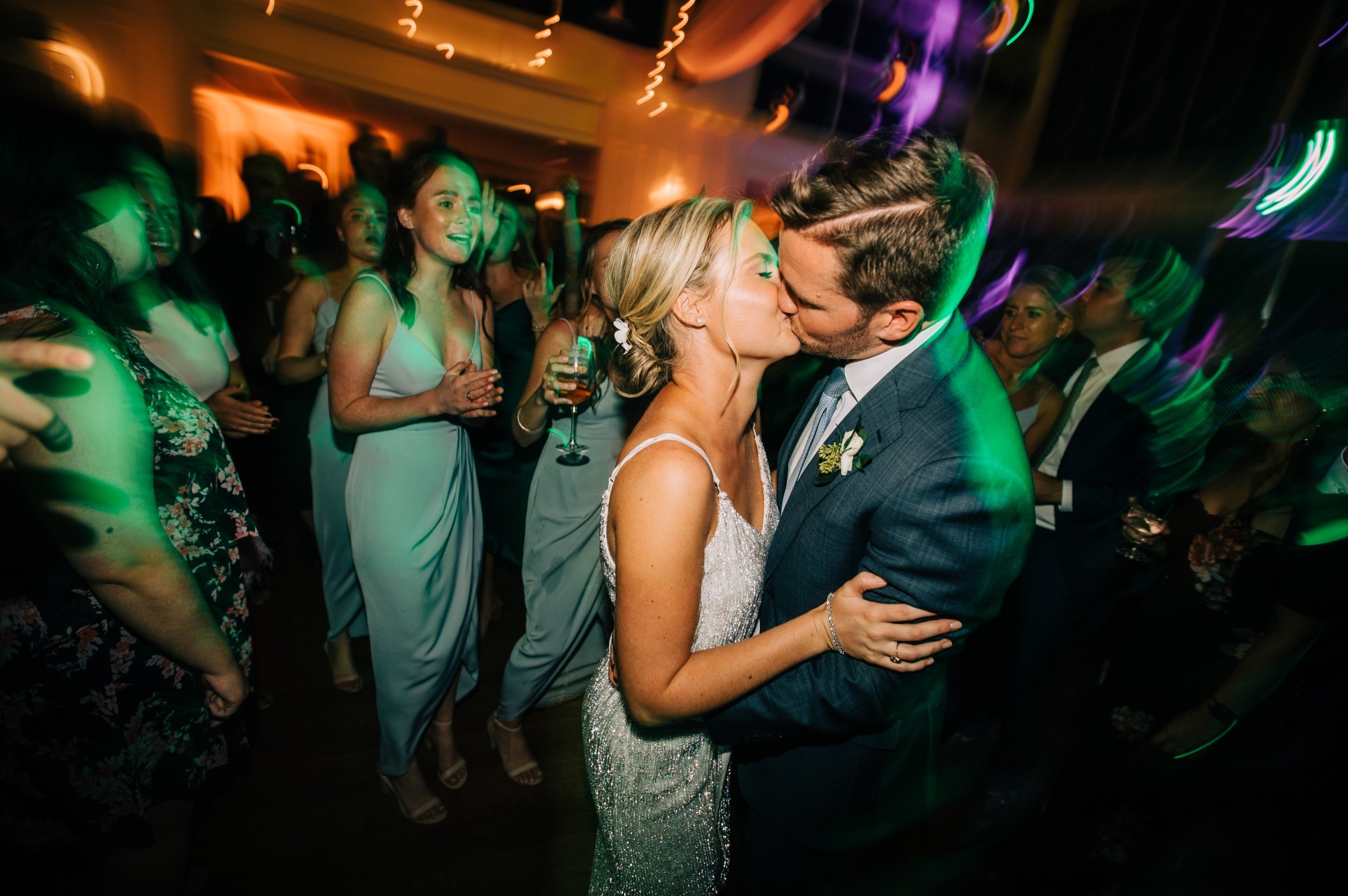 71_Bride and groom kiss bay head yacht club wedding reception.jpg