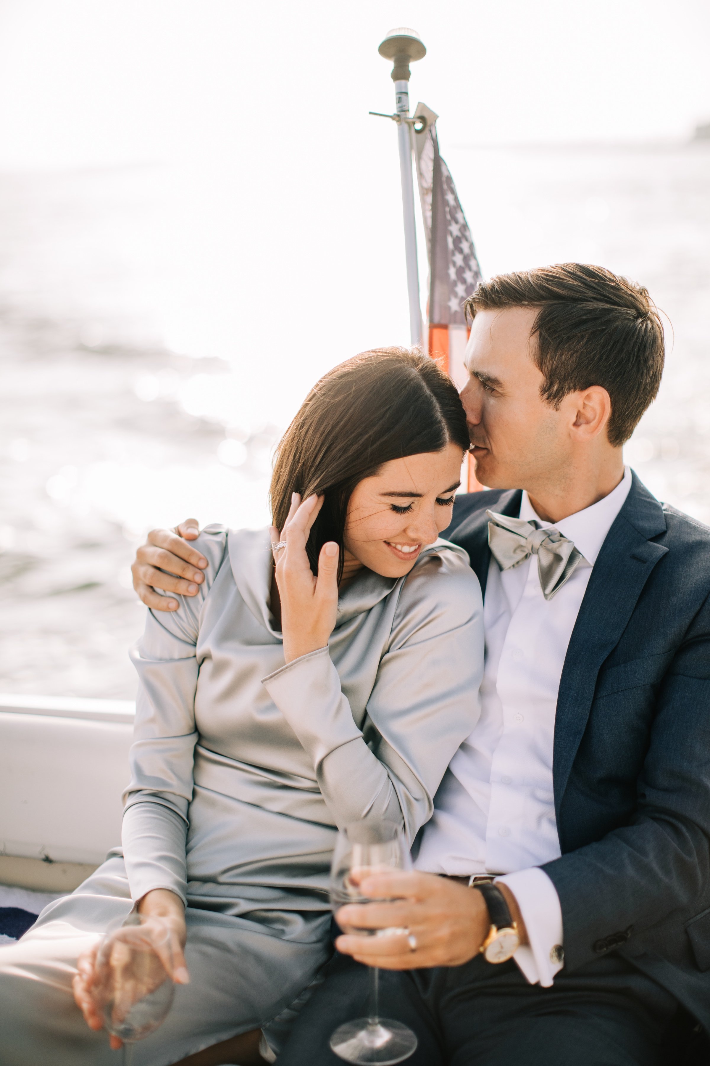 21_couples portrait on boat ride bay head yacht club.jpg