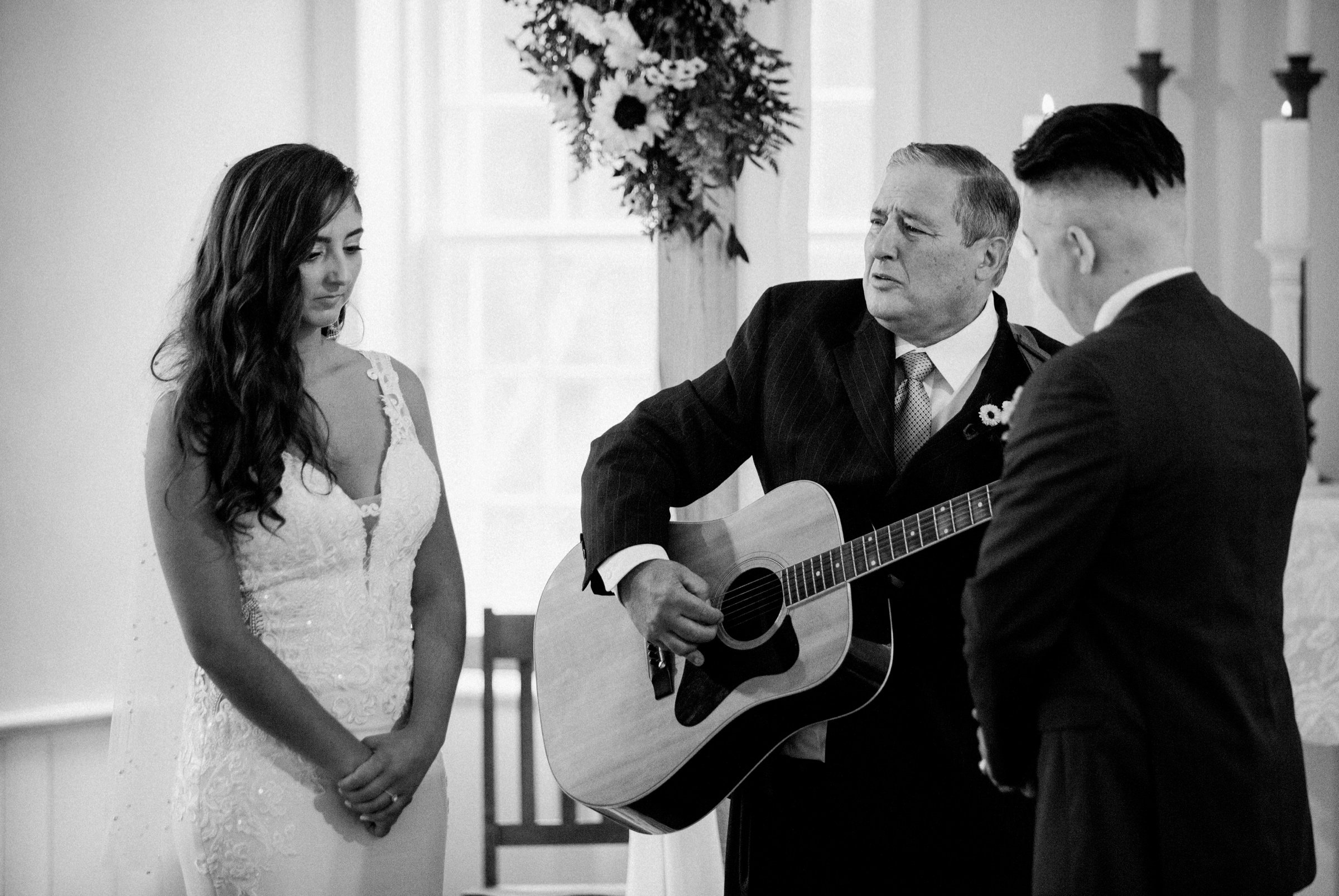 21_sentimental song at rainy wedding day allaire village.jpg