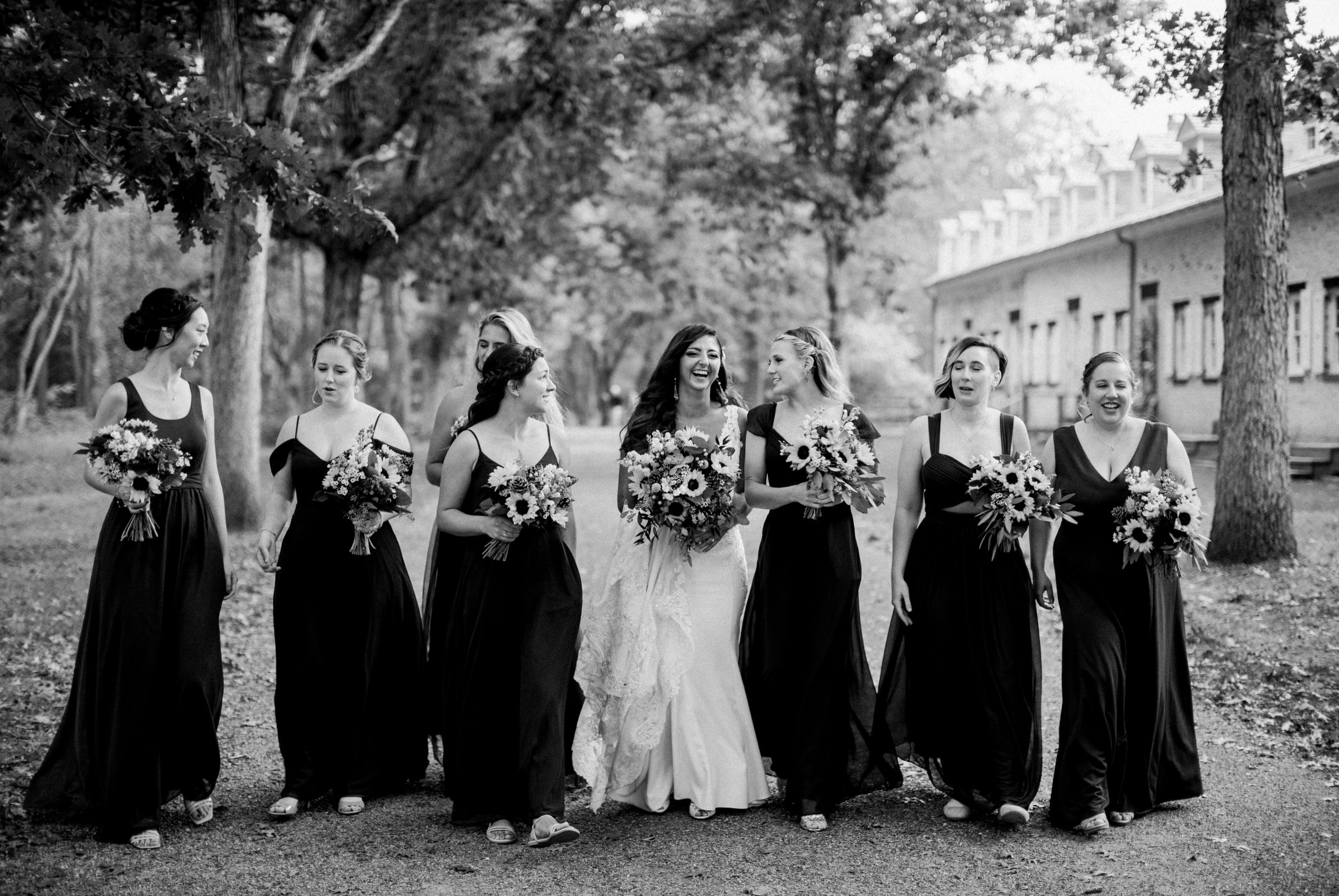 30_bridesmaids with bride rain wedding day.jpg