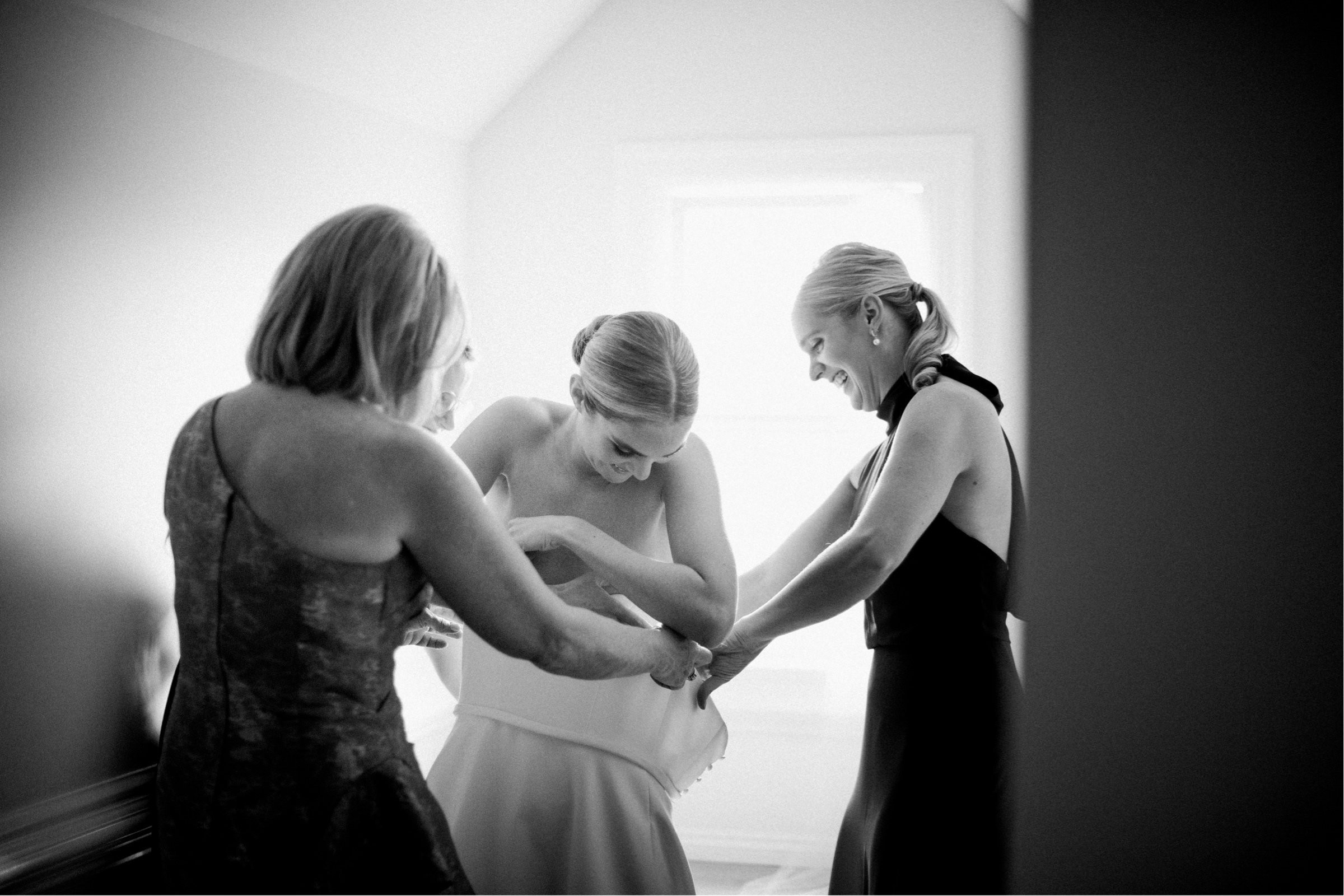 08_bride getting into gown spring lake wedding new jersey.jpg