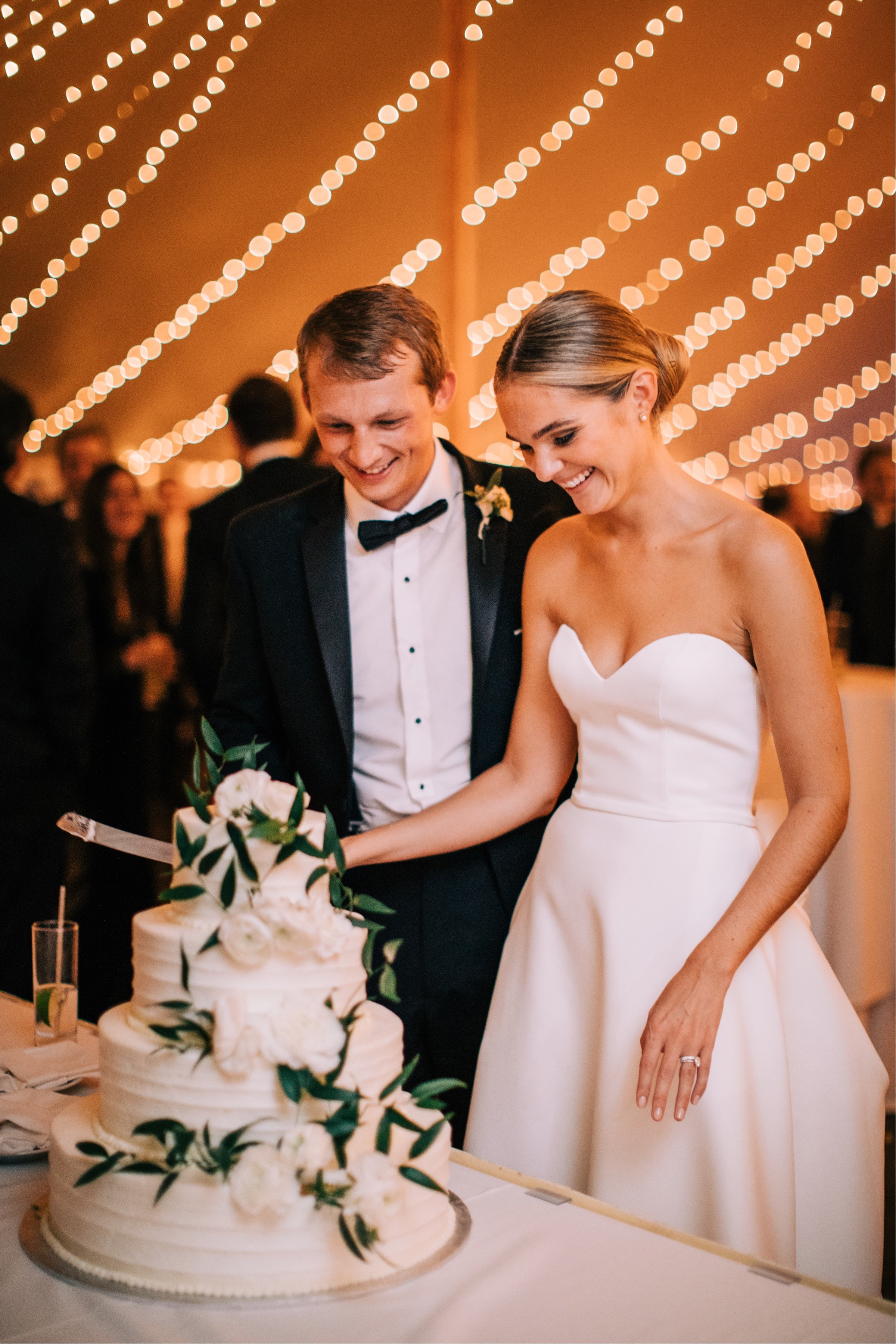 54_cake cutting photo spring lake golf club tent reception.jpg