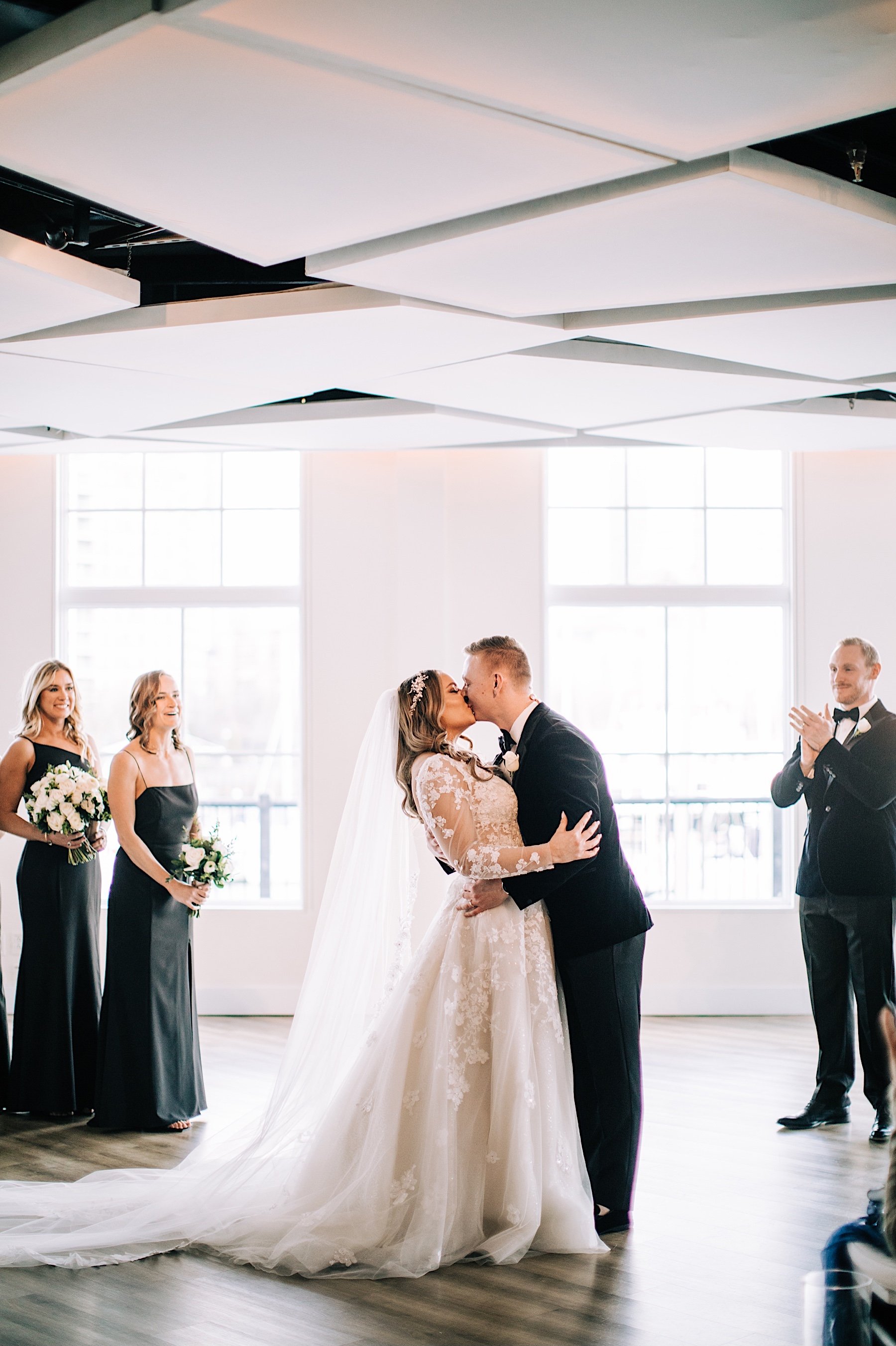 63_first kiss at jersey city wedding nyc skyline.jpg