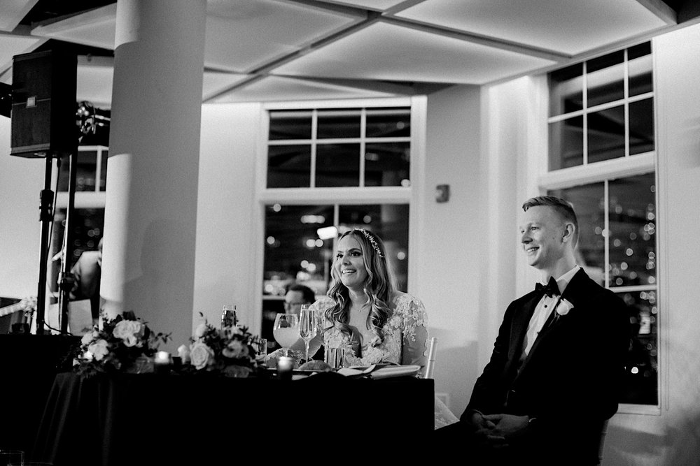 78_bride and groom during speeches at jersey city wedding reception.jpg