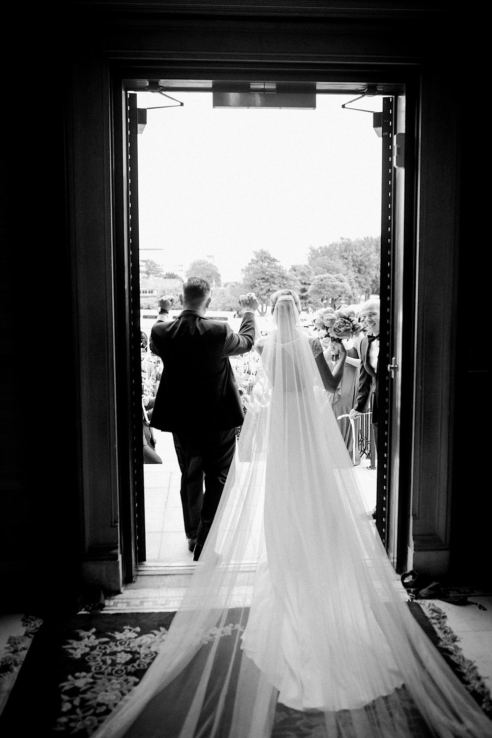 43_grand exit from st catherines church spring lake nj wedding.jpg