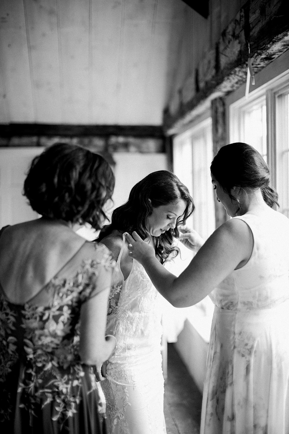 35_bride getting into gown cross keys estate wedding.jpg