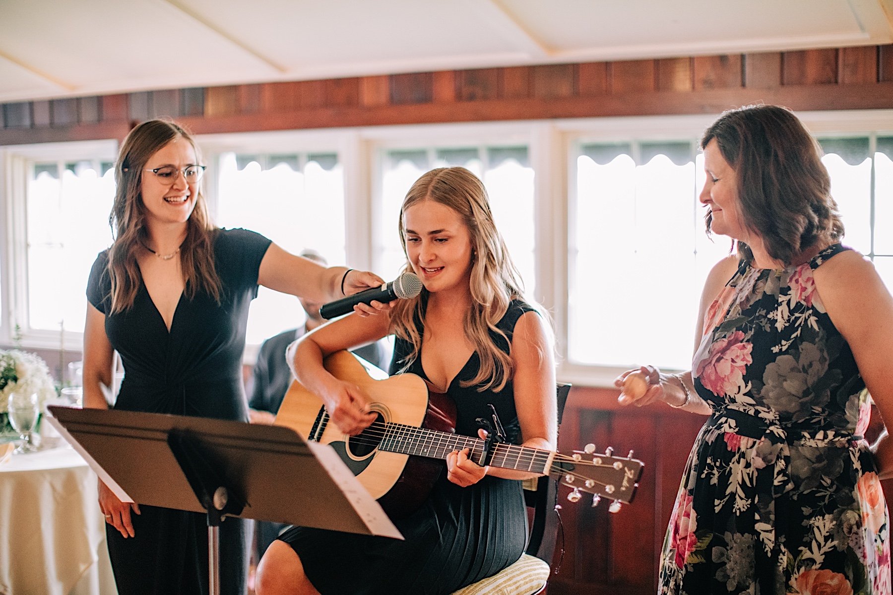 19_singing a song for the couple north shore house rehearsal dinner.jpg