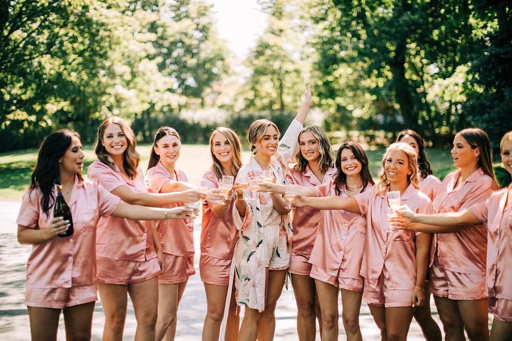 07_bride with bridesmaids toast red bank.jpg