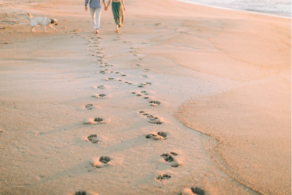 10_footprints in the sand engagement session.jpg