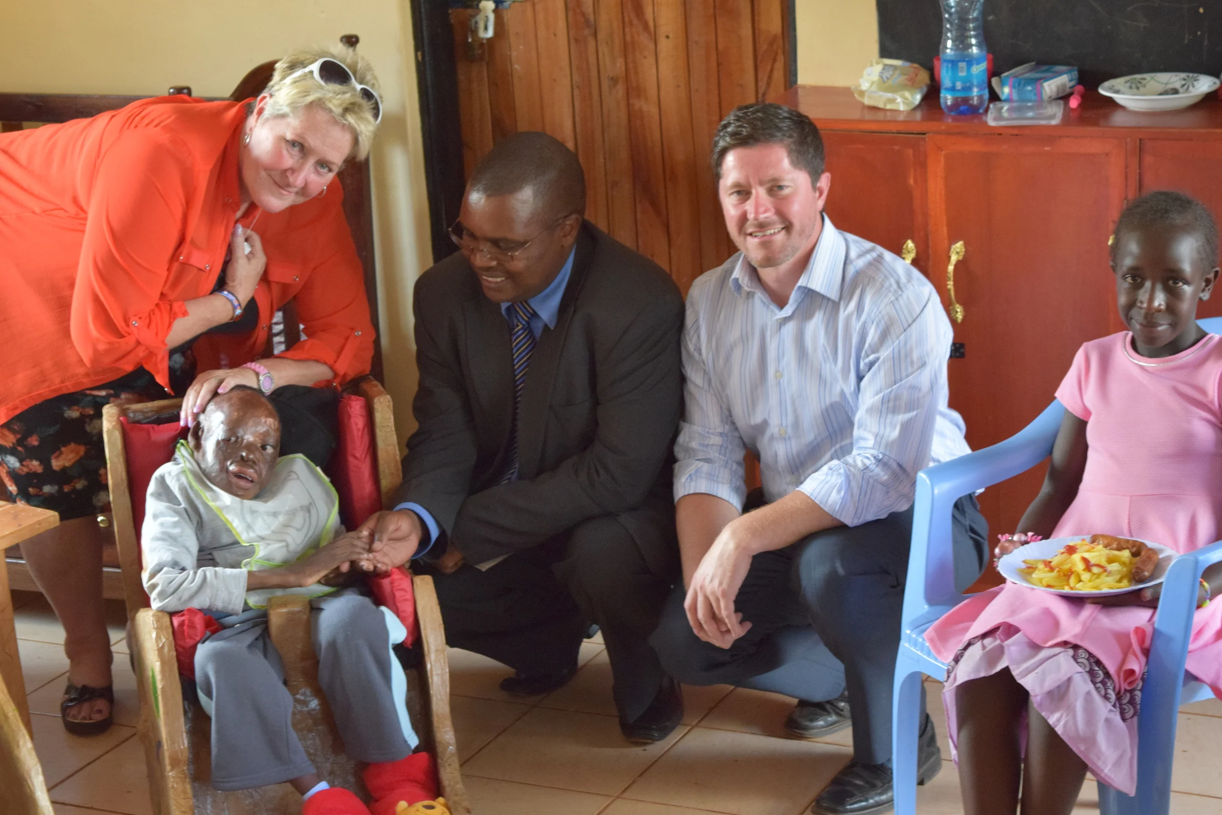 The Hon. David Mwangi Mugo (centre), the Speaker of the County Assembly of Nyeri, with Mrs Terry Fairfowl (left) and Pastor David Murray (right), meets Kenuah (front left) and Fiona (front right) in our Sanctuary day care centre.