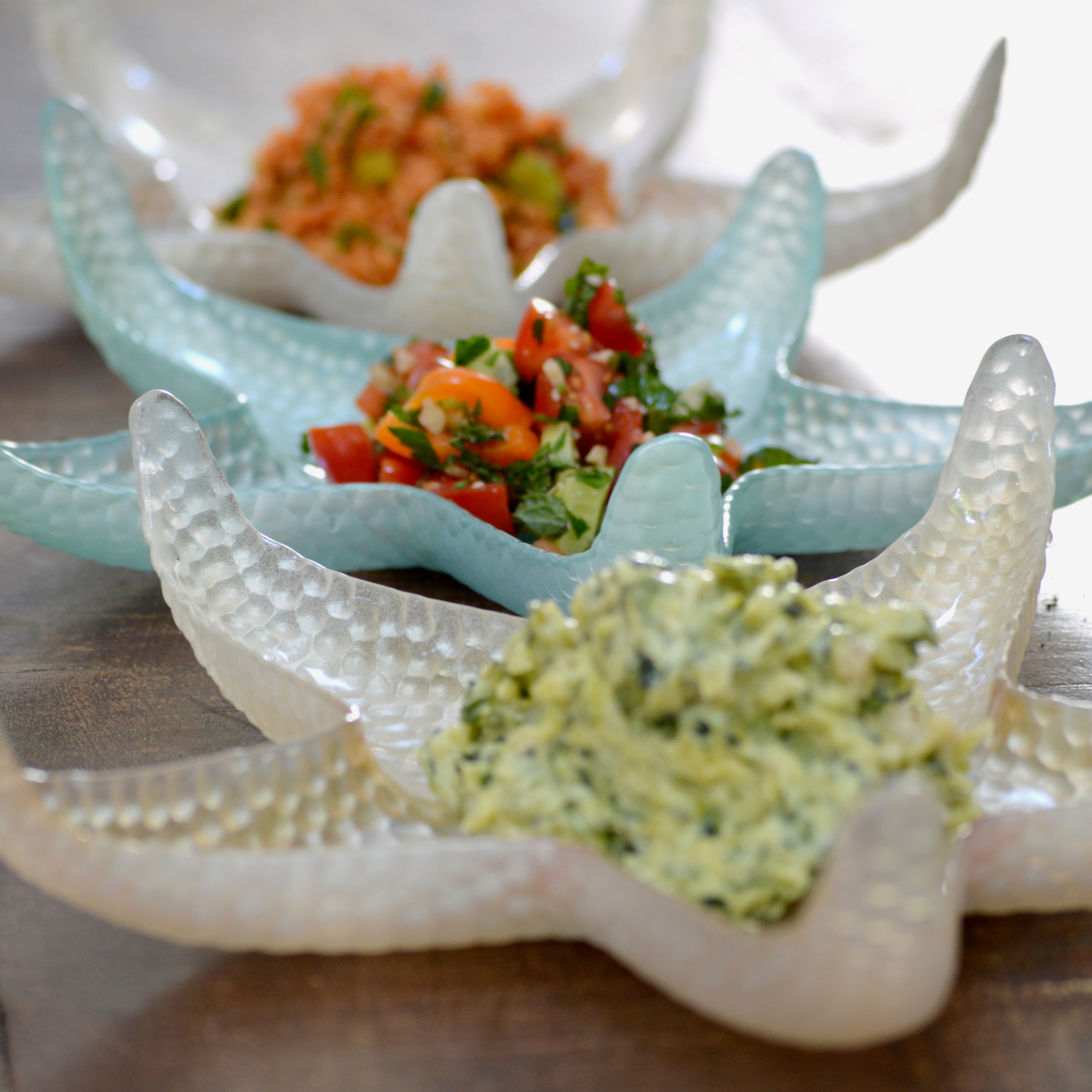 Salad trio ' Sauted zucchini in garlic yogurt, spicy tomato salad with herbs and walnut, bulgur salad Vegetarian /contains nuts