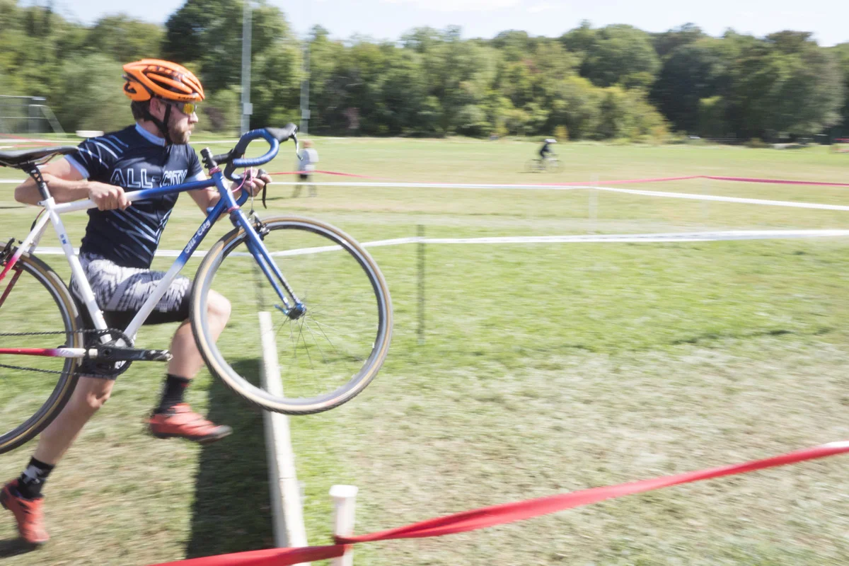 Courses often feature brief off the bike sections. Kevin and his Nature Boy leap over the barriers at Hyattsville CX. 