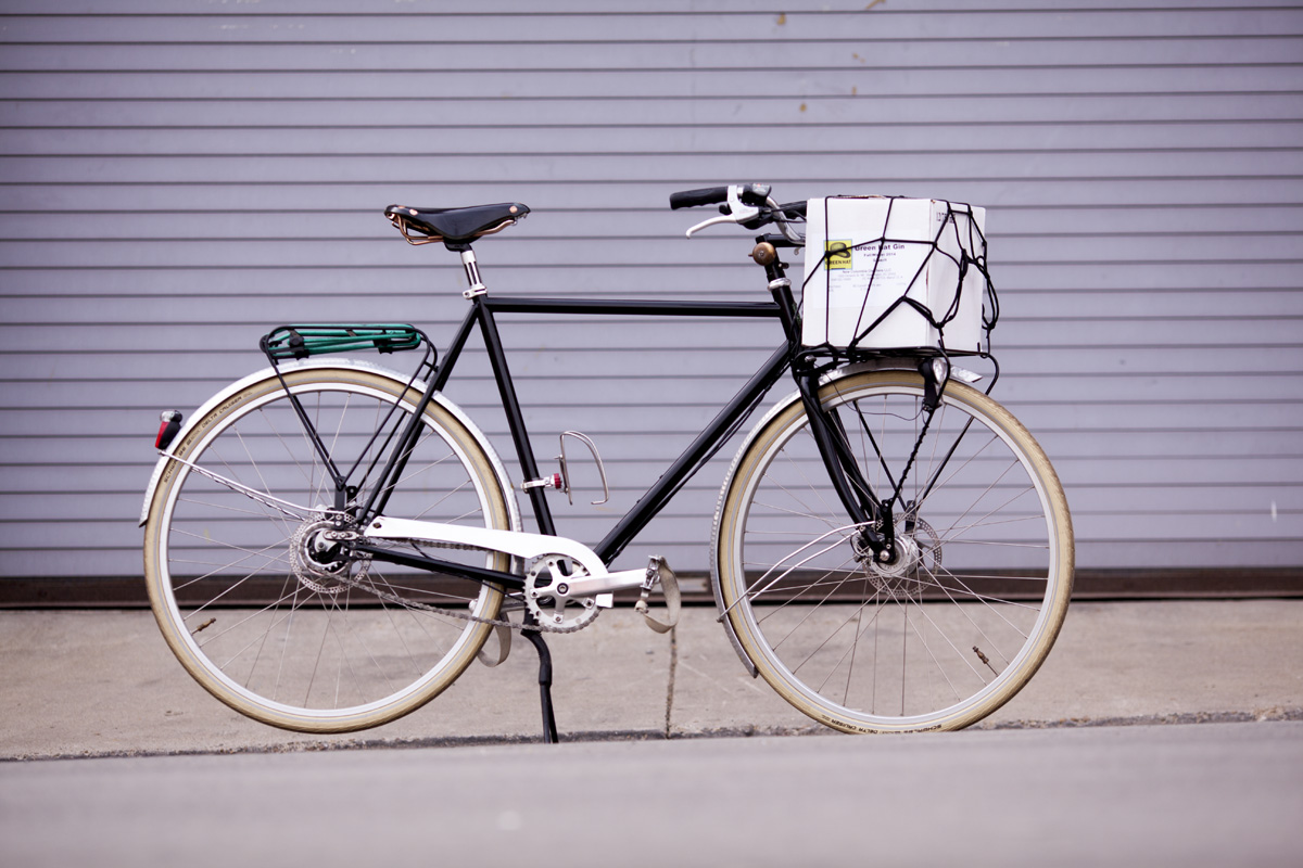 A.N.T Boston Roadster featuring handmade frame and racks. John often delivers small orders to bars and restaurant by bike. 