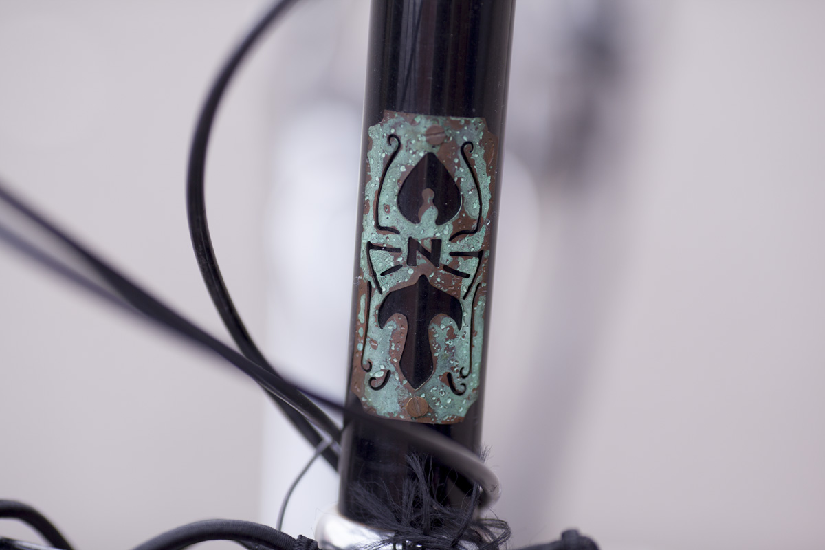 A.N.T headbadge. Made of copper and steel, just like the distillery.