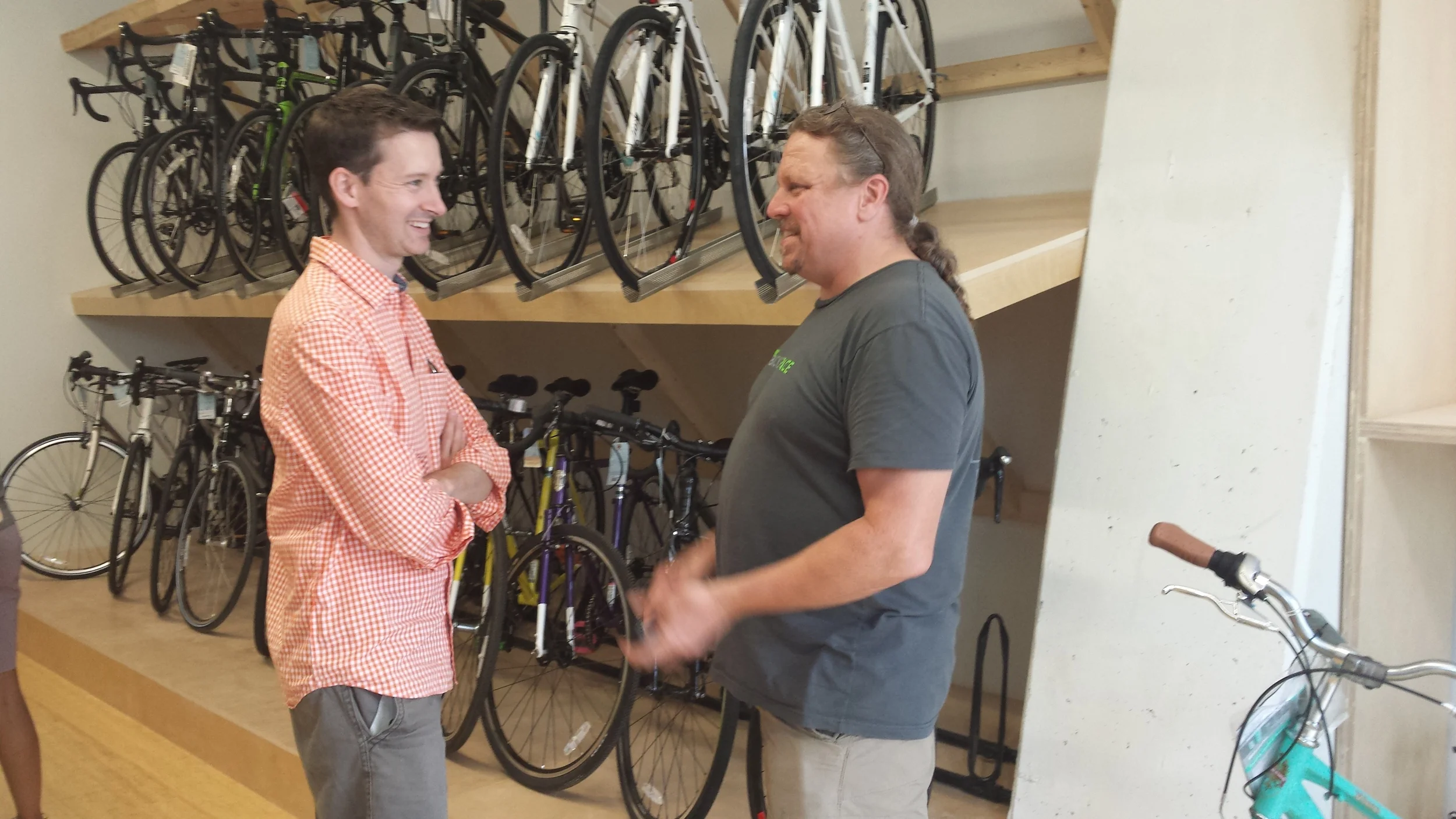 Ward 6 Councilman Charles Allen, left, with BicycleSPACE co-owner Phil Koopman, gesturing so enthusiastically his hands are blurry. We love how a gorgeous Celeste Bianchi Milano Dama photobombs at right.