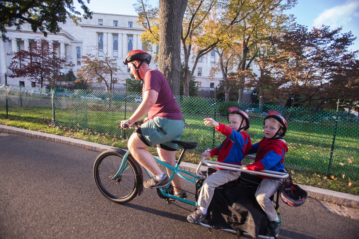 There's a reason it's called Capitol Hill. John climbs eastbound with the twins. 