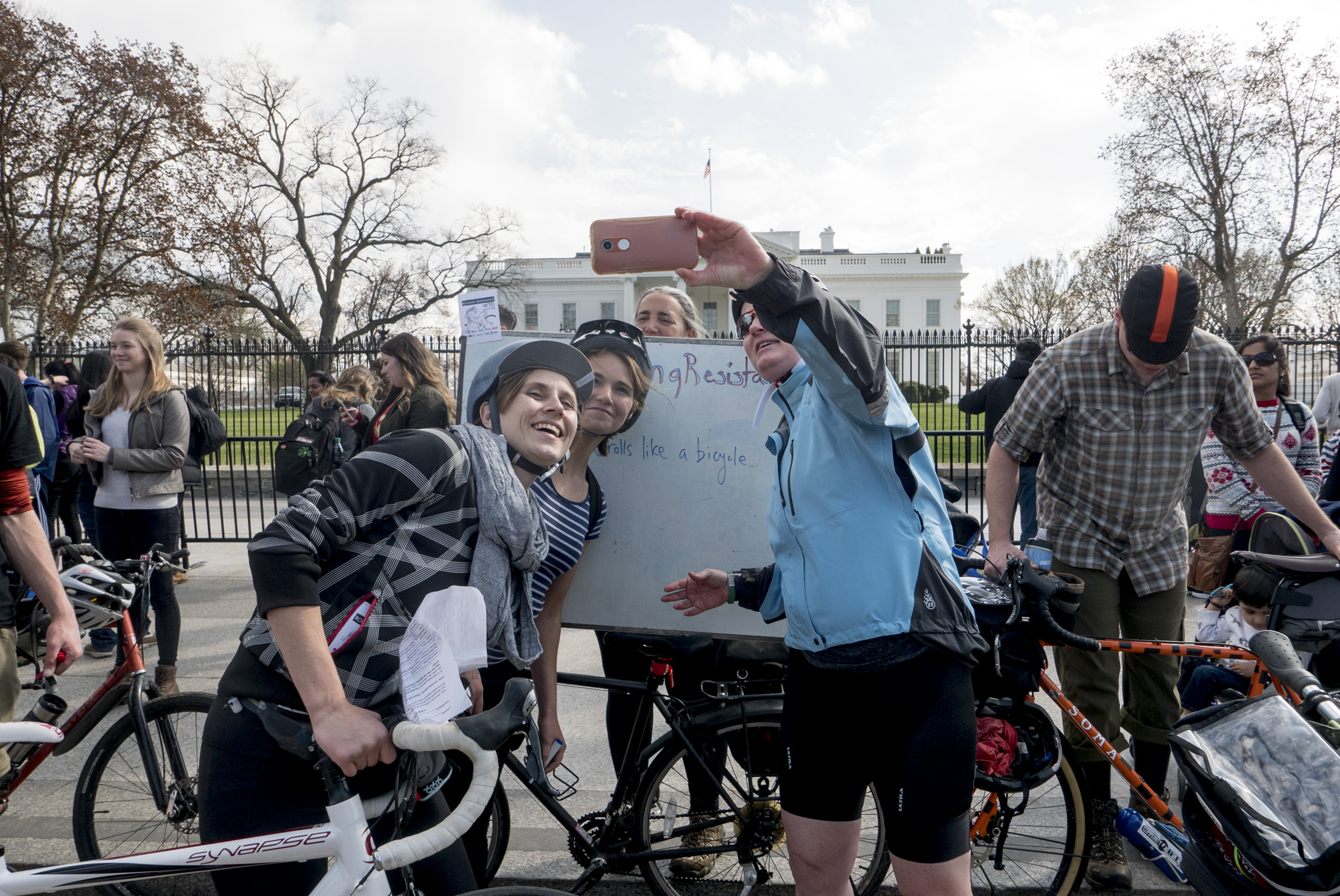 Leigh Ann, board member of HIPS (Rolling Resistance beneficiary), and team members visit the White House checkpoint where they had to answer "Who were the first people to picket the White House?" and we're encouraged to leave a message to the new resident. 
