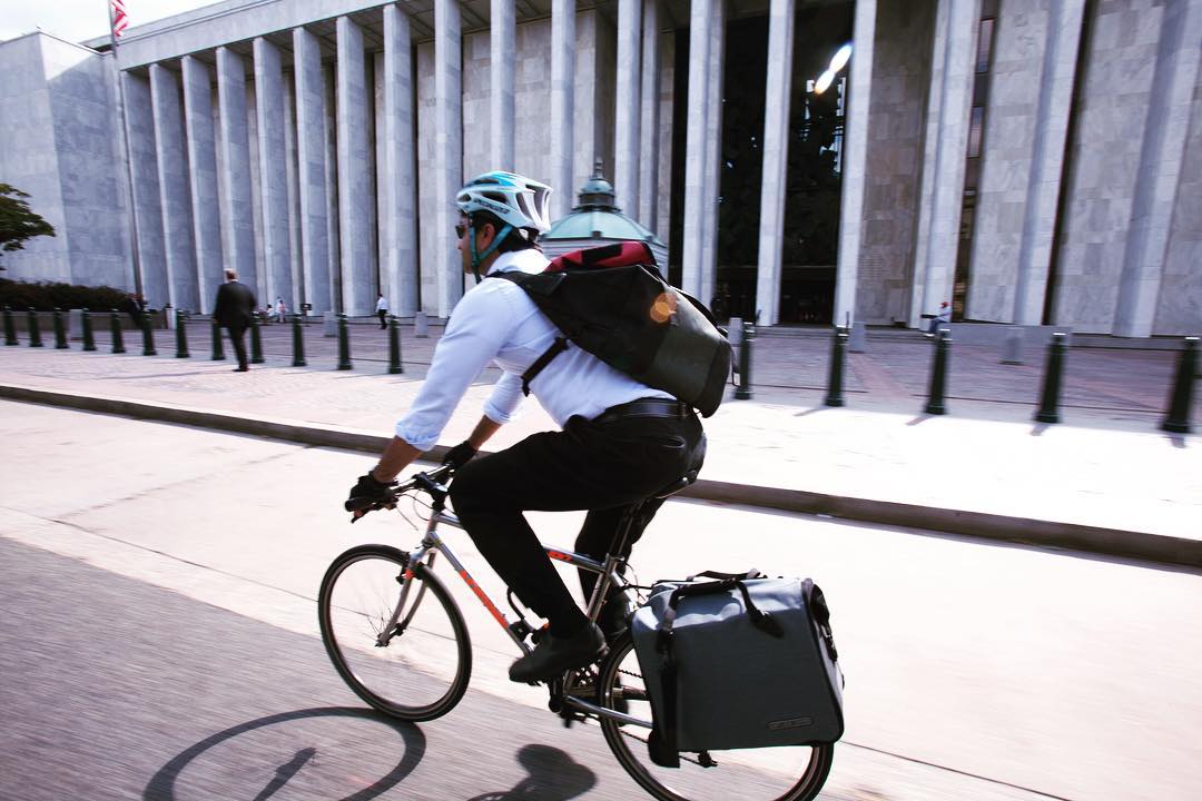 Sujith riding with an Ortlieb Commuter pannier. 