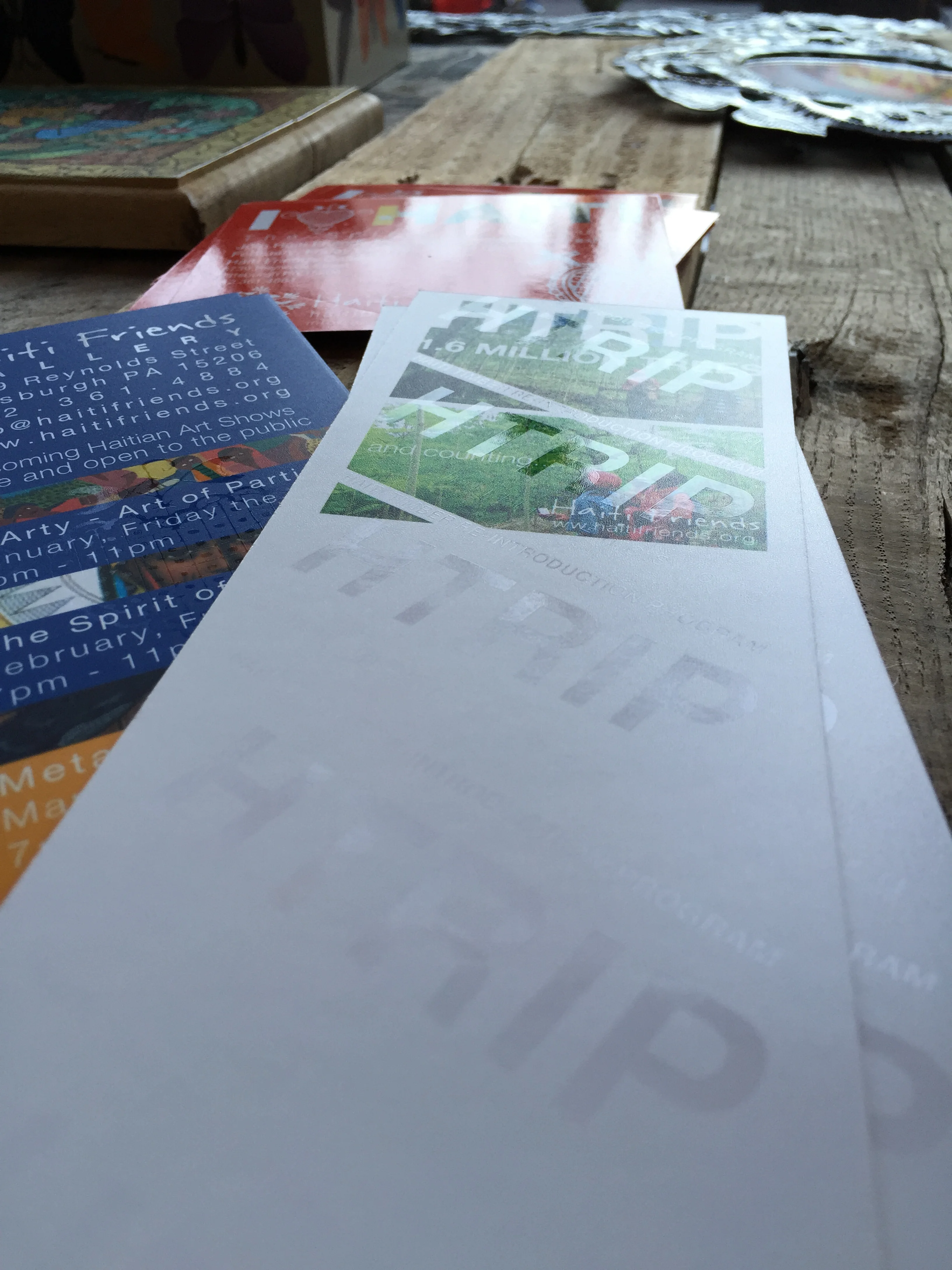 Back side of the flyer advertising our HTRIP Reforestation project in Haiti sporting a fancy spot UV printing method
