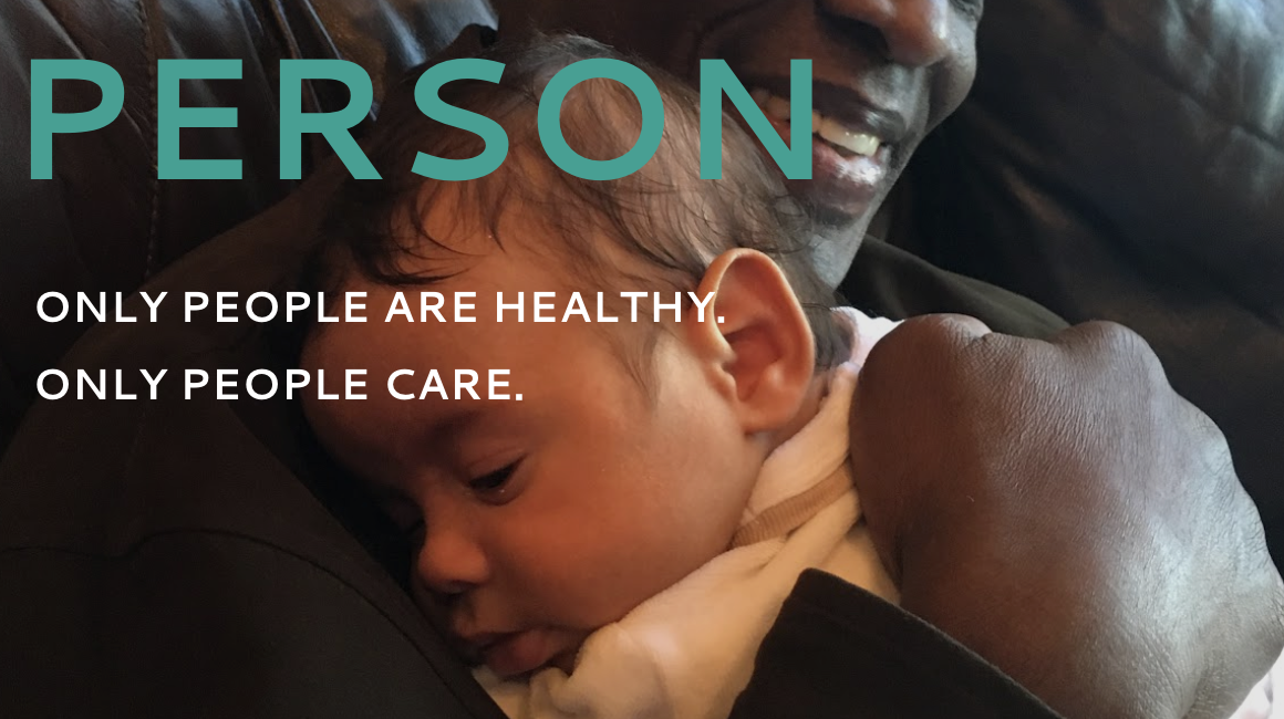 Godfred Otuteye cuddles his grandson Lucas Reitzner