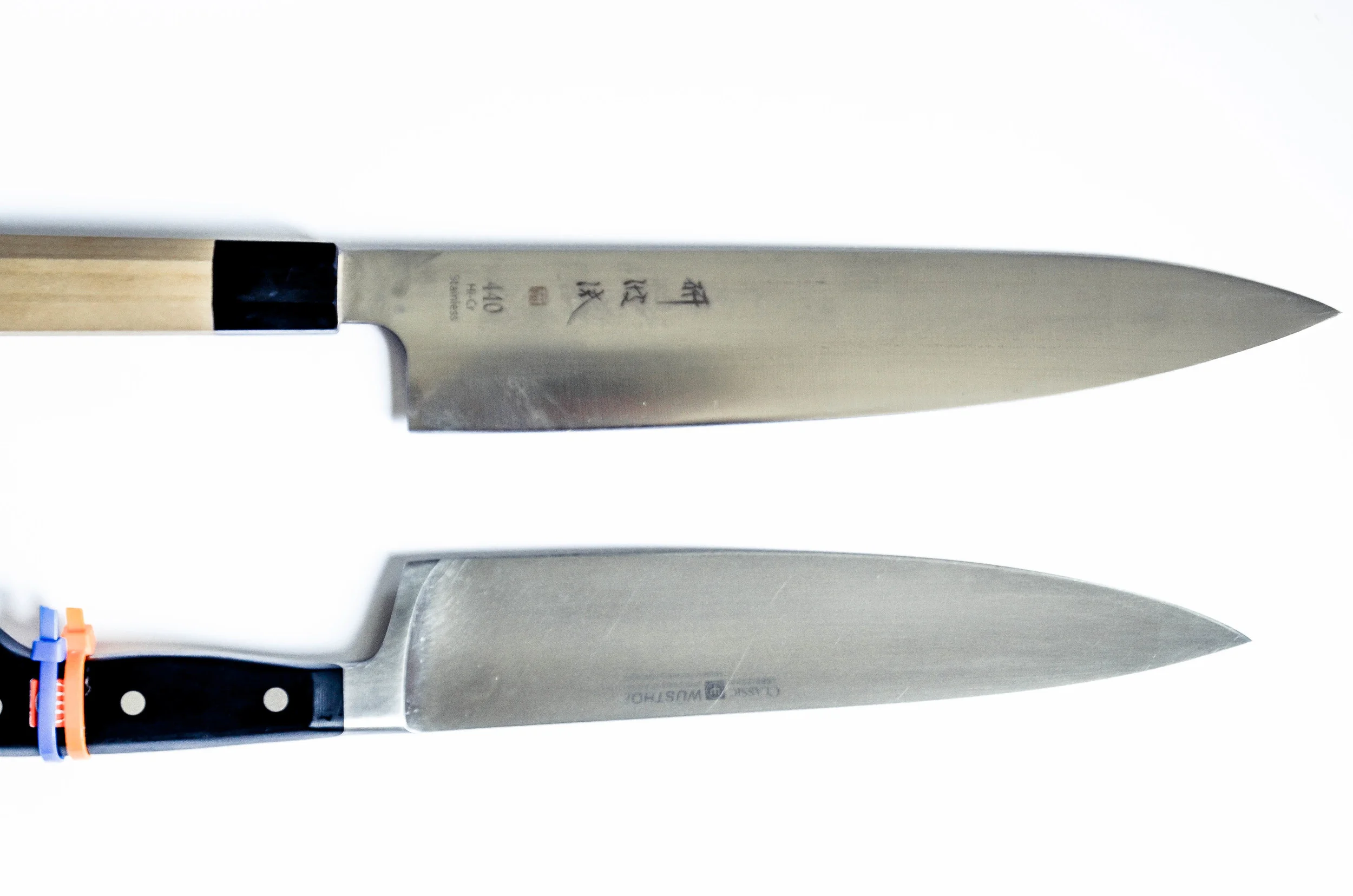 i actually have two chef's knives - the top is a western-style japanese blade from korin . the bottom is my school-issue wusthof blade. 