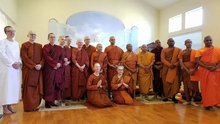 Ven. Dhammadipa (also known as Konin) kneeling on left, Ven. Cittananda kneeling on right