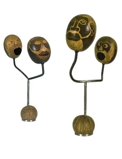 Isla de Mente 1995 (2 views) steel, 2 calabashes, coconut, wax Private Collection