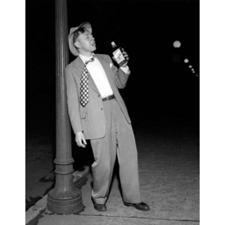 drunk-mid-adult-man-leaning-against-a-lamppost-holding-a-bottle-of-alcohol-poster-print-18-x-24_918032.jpg