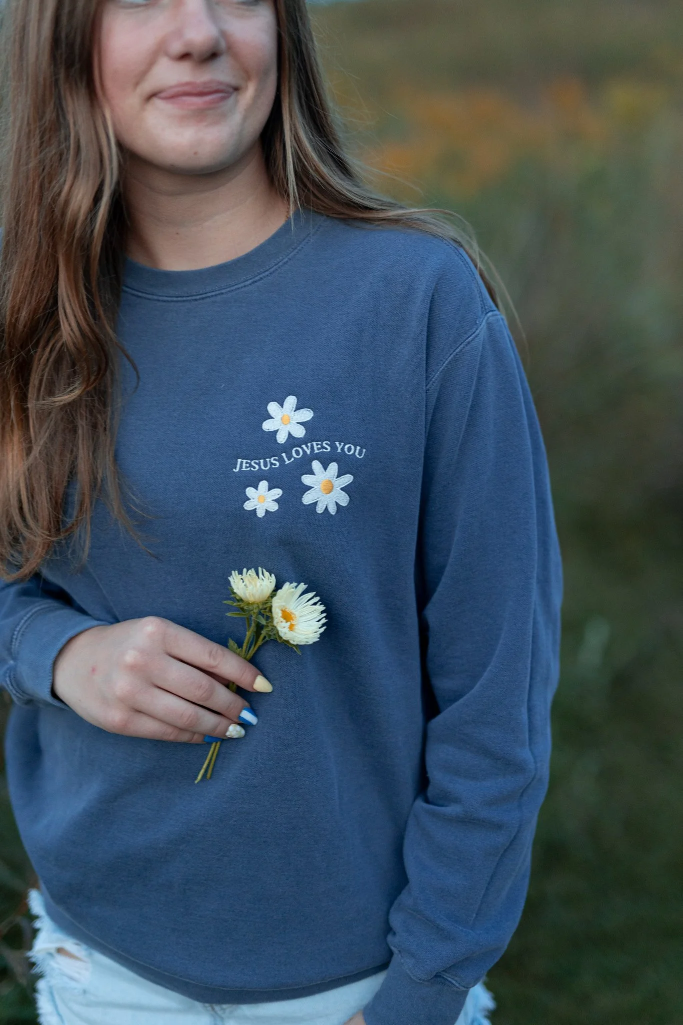 embroidered daisy comfort colors sweatshirt with Jesus loves you