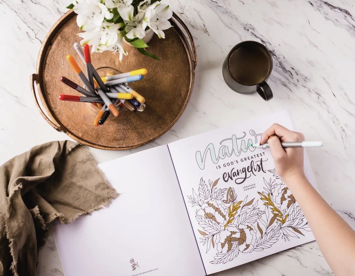 flat lay christian coloring book with gold accents and bible verses