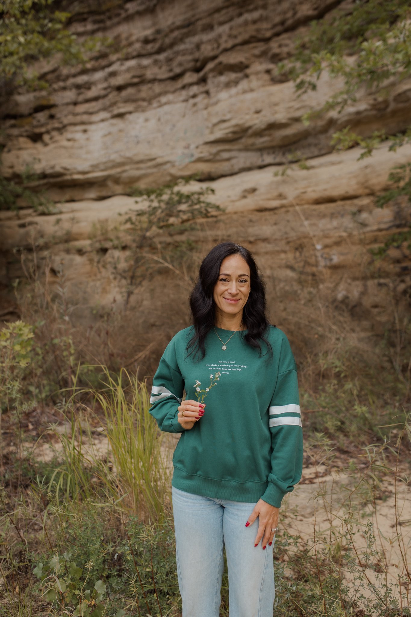 Fall line photoshoot for christian clothing brand featuring bible verse psalm 3:3.  green varsity sweater