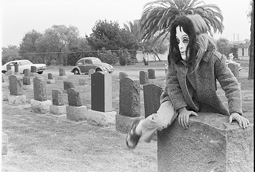 17-Dia-de-Los-Muertos-Girl-climbing-stone.jpg