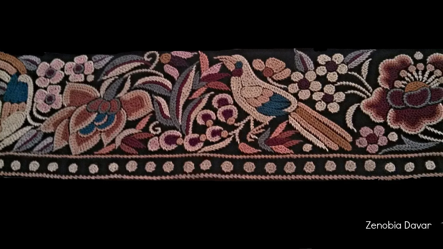 Multicolour Bird & Floral design border worked in Forbidden stitch.