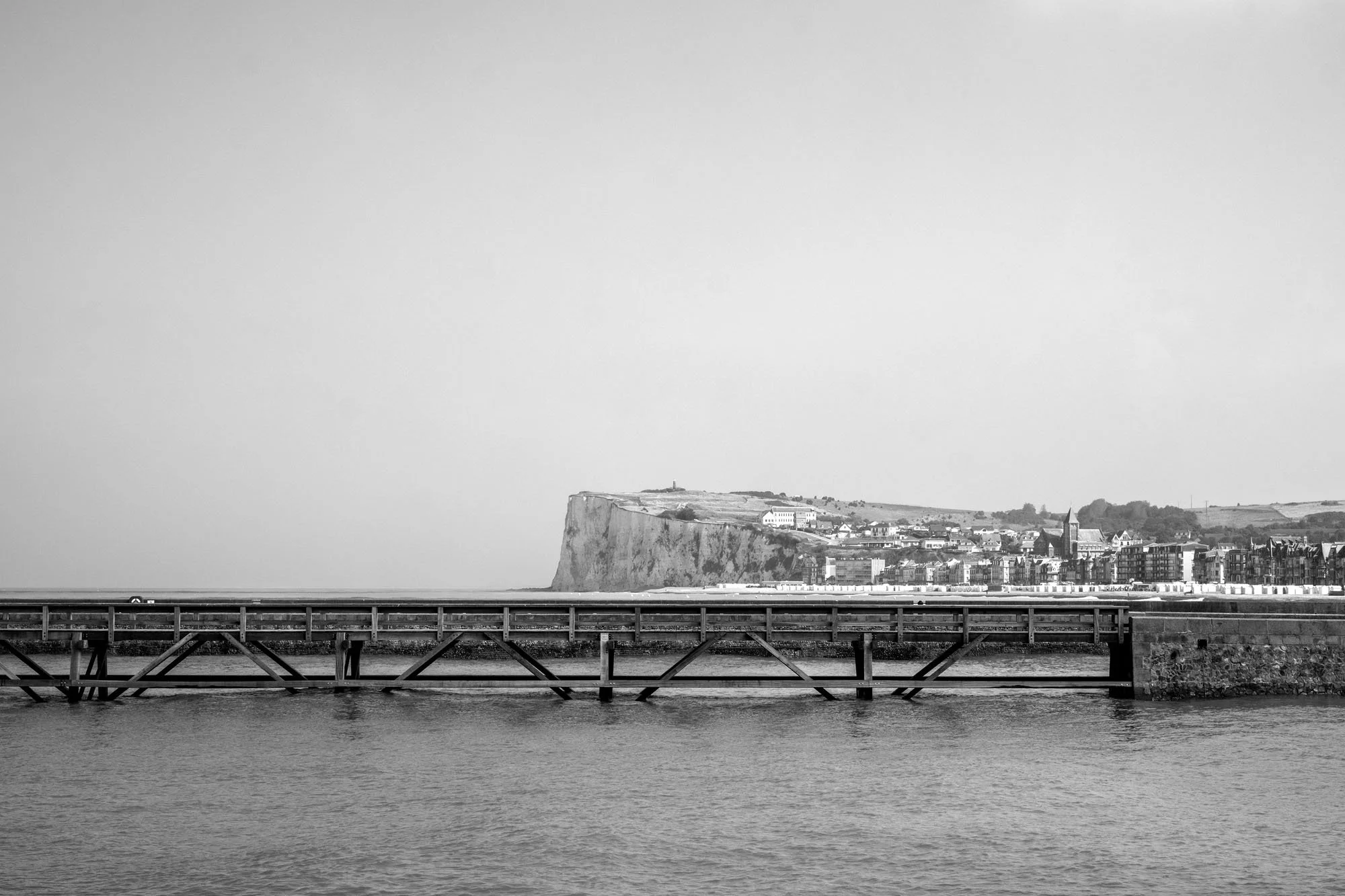  Black-and-white seaside photograph on the beach at Le Tréport, Normandy, Mer-les-Bains cliffs view from Le Tréport, by Chris Perona. 